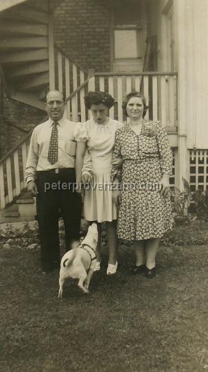 Peter Provenzano Photo Album Image_copy_194.jpg - From left to right: Vincent and Santina Provenzano with their youngest daughter Dominica (May) and Butchie (the dog). Taken at 
3128 North Mason Avenue, Chigago IL.